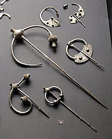 Viking period pennannular brooches from the Penrith Hoard, three of the "thistle" type. Britishmuseumpenrithhoardbrooches.jpg