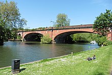 The bridge after electrification gantries were added Brunel's railway bridge at Maidenhead from the Thames Path National Trail, geograph 5893373 by Dave Kelly.jpg