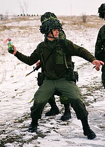 Canadian Forces soldier throwing Molotov cocktail.jpg
