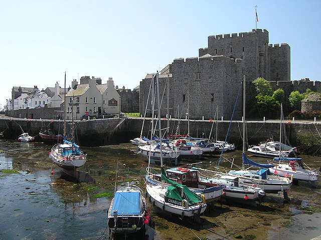 Castle Rushen seen across Castletown Harbour at low tide