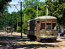 Two 900-series Perley Thomas streetcars in New Orleans Charles Ave. Streetcar (5722747790).jpg