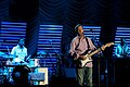Steve Jordan, (left, on drums) Eric Clapton, center stage, Crossroads Guitar Festival