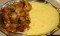 Rabbit meat and polenta, a traditional peasant food of Veneto, Italy