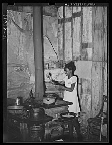 Cooking at stove in old Trepagnier Plantation House, Norco, Louisiana, October 1938 Cooking at stove in old Trepagnier Plantation House, Norco, Louisiana, October 1938.jpg