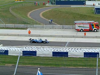 Franchitti celebrating winning the event. Dario Franchitti celebrating victory - 2002 Sure For Men Rockingham 500 (4).jpg