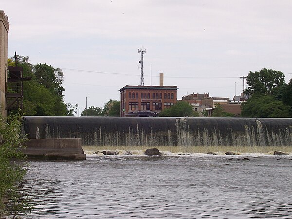 The downstream of Watertown's two dams, with a portion of downtown in the background