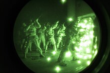 Maritime Raid Force conduct breaching and assault operation aboard ship Force Recon Marines take over ship at night 150417-M-PA636-017.jpg