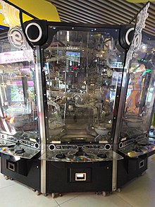 Galileo Factory (SEGA 2009), a coin pusher game where balls travel through an elaborate roller coaster system inside the machine before being dropped onto the playfield, or onto a roulette wheel. Galileo Factory 20170726 124748.jpg