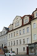 Residential house with rear building in closed development