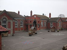 Hassocks Infants School. The inlaid clock above the entrance was purchased and installed in 2000 from money raised through a special "Millennium Fund". Hassocks Infants School.jpg