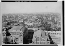 Tomlinson Hall (left) and City Market (center) in 1888 Historic American Buildings Survey COPY OF CA. 1888 PHOTO LOOKING NORTH FROM COURTHOUSE TOWER, SHOWING MARKET HOUSE (RIGHT) AND TOMLINSON HALL (LEFT) - Indianapolis City Market, HABS IND,49-IND,14-7.tif