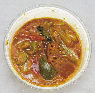 Indian mixed pickle, containing lotus root, lemon, carrot, green mango, green chilis, and other ingredients