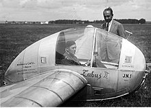 The JN 1 glider, the constructor stands next to the glider