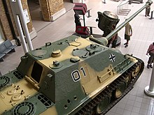 Jagdpanther
at Imperial War Museum (London), from above. Note the three shell holes in the side. The rear hatch of the casemate is missing. Jagdpanther IWM.jpg