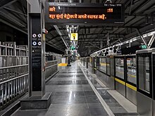 Passenger information display and platform screen doors at Kandarpada station. Kandarpada, Metro Station 01.jpg