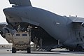 Two U.S. Army M142 High Mobility Artillery Rocket Systems assigned to the 1st Battalion, 14th Field Artillery Regiment are being loaded into a U.S. Air Force C-17 Globemaster III assigned to the 816th Expeditionary Airlift Squadron as part of joint training at Ali Al Salem Air Base, Kuwait, Jan. 27, 2021. Joint training offers both soldiers and Airmen familiarity with working together to load equipment onto an aircraft, providing the U.S. military with an agile and ready force. (U.S. Air Force photo by Senior Airman Kristine Legate)