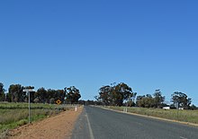 Road heading towards woodland