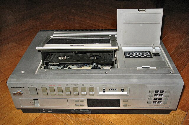 Top-loading cassette mechanisms (such as the one on this VHS model) were common on early domestic VCRs.