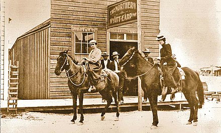 Wyatt Earp's Northern Saloon, Tonopah, Nevada, c. 1902. The man in the center is believed to be Wyatt Earp, and the woman on the left is often identified as Josephine Earp