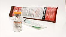 An emergency opioid overdose kit, containing a single dose of naloxone, needle, and syringe. Opiod Rescue Kit 2.jpg