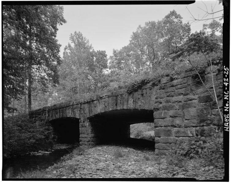 File:Otter Creek Bridge -2. View of the stone facing common on nearly all concrete box culverts. The stone faced arch mimics rigid frame structures. Culverts were used for a variety HAER NC,11-ASHV.V,2-25.tif