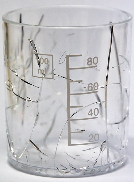 File:PMMA measuring cup cracked by ethanol.jpg