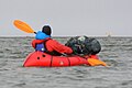 Packrafter and polar bear on the Colville River. North Slope, Alaska.jpg