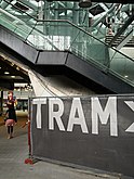 Picture of a large canvas-sign to indicate the tram platform in Central station The Hague, The Netherlands, June 2013; photo, Fons Heijnsbroek