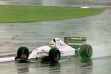 Pierluigi Martini - Minardi M193 during practice for the 1993 British Grand Prix (33645875476).jpg