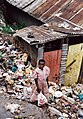 Poor African boy in pink dress Kibera slum, Nairobi, Kenya by Michael E. Arth.jpg