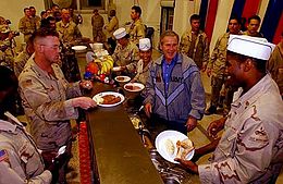 U.S. President George W. Bush visits Iraq to have Thanksgiving dinner with soldiers in 2003. President Bush Thanksgiving Day dinner in Baghdad 2003.jpg