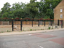 The site of the Rastafarian Temple in July 2007, now marked with green, yellow and red coloured railings Rasta temple remains stagnesplace July 07.jpg