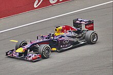 Vettel went on a nine-consecutive race win after the summer break. Pictured here is during the 2013 Indian Grand Prix where he clinched his fourth World Drivers' Championship title Red Bull racing, Noida F1 2013(Ank Kumar) 10.jpg