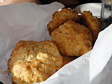 A basket of Cheddar Bay Biscuits from Red Lobster Red Lobster - Biscuits (6022841688).jpg