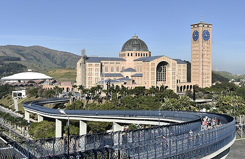 View of Basilica of Our Lady of Aparecida with the walkway called "Passarela da Fé", connecting the old and the new church, in the foreground.