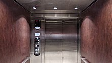 Cascading telescopic 2-speed door configuration inside of an elevator Schindler 330A hydraulic elevator interior with cascading doors.jpg