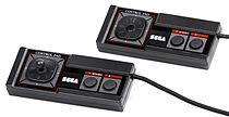 Two versions of the Master System controller, including an early model with a joystick d-pad Sega-Master-System-Controllers.jpg