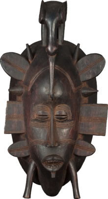 A mask created by the Senufo people, which would influence Jarrell's paintings and sculpture. Senoufo mask-romanceor.png