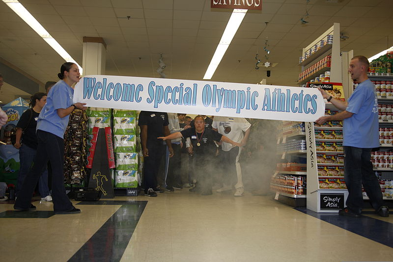 File:Special Olympics participants gaze through mist generated by a fog machine while they prepare to run through a banner before the start of the competition at U. S. Marine Corps Air Station Cherry Point NC 120109-M-OT671-608.jpg