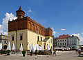 * Nomination Market Square with the City Hall in Tarnów --Jakubhal 21:01, 2 October 2011 (UTC)  Info 2nd time nomination. Previously reviewed and withdrawn due to strong CAs. Now reworked. --Jakubhal 21:01, 2 October 2011 (UTC) * Promotion Please have a look to annotation)--Jebulon 07:10, 3 October 2011 (UTC)  Info Thanks, but I disagree. This is smoke from the hole in the wall (strange chimney system, but the feature of the building...). Please take a look at another photo from different angle and without sun. --Jakubhal 07:47, 3 October 2011 (UTC)  SupportŁadne zdjęcie. --Sfu 08:45, 6 October 2011 (UTC) Thanks, very interesting ! QI indeed !--Jebulon 15:33, 6 October 2011 (UTC)