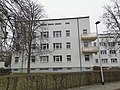 GEWOG settlement;  Millennium settlement Meißen: Apartment building in a settlement with hedges to enclose the front gardens and the surrounding horticultural open space (garden monument)