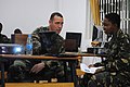 U.S. Navy Hospital Corpsman 1st Class Will Brogdon, left, mentors Tanzanian People's Defence Force Cpl. Zainabu Dadi Salum on instructing a class during a tactical combat casualty care course in Dar es Salaam 120301-N-RB546-002.jpg