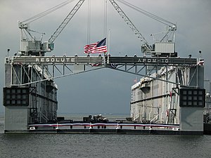 US Navy 031107-N-3312P-002 The ensign is lowered for the last time as the floating drydock Resolute (AFDM 10) is deactivated following 58 years of service.jpg