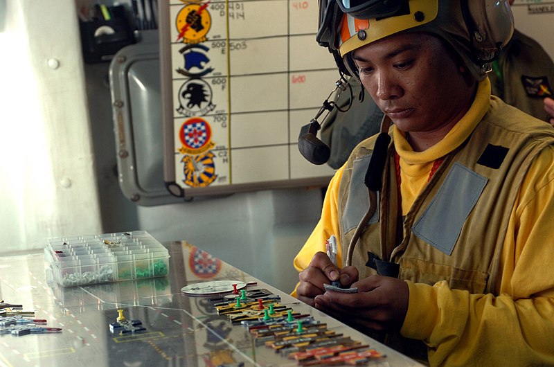 File:US Navy 060619-N-0555B-220 Senior Chief Aviation Boatswain's Mate Terry Libed reviews the launch and recovery schedule before heading out to start the next cycle of flight operations for Exercise Valiant Shield 2006.jpg