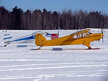 Wag-Aero Super Sport (front) with a Piper PA-12. Wag Aero Super Sport C-GETV and Piper PA-12 C-FBNZ.JPG