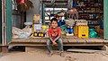 Young vendor in a grocery store in Don Som (2).jpg