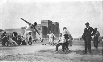 1904 Olympics. Francis Gymnasium can be seen in the background. 1904 Olympics. Defending his title. Myer Prinstein, Greater New York I. A. C.jpg