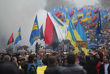 Ukrainian nationalists carry portraits of Stepan Bandera and flags of the Ukrainian Insurgent Army. 2012 UPA March in Kiev.jpg