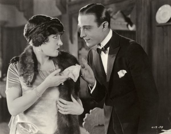 Theodora Fitzgerald (Swanson) looks into the eyes of Lord Hector Bracondale (Valentino) who returns her handkerchief in Beyond the Rocks