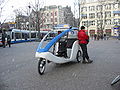 Bicycle taxi Amsterdam with snow